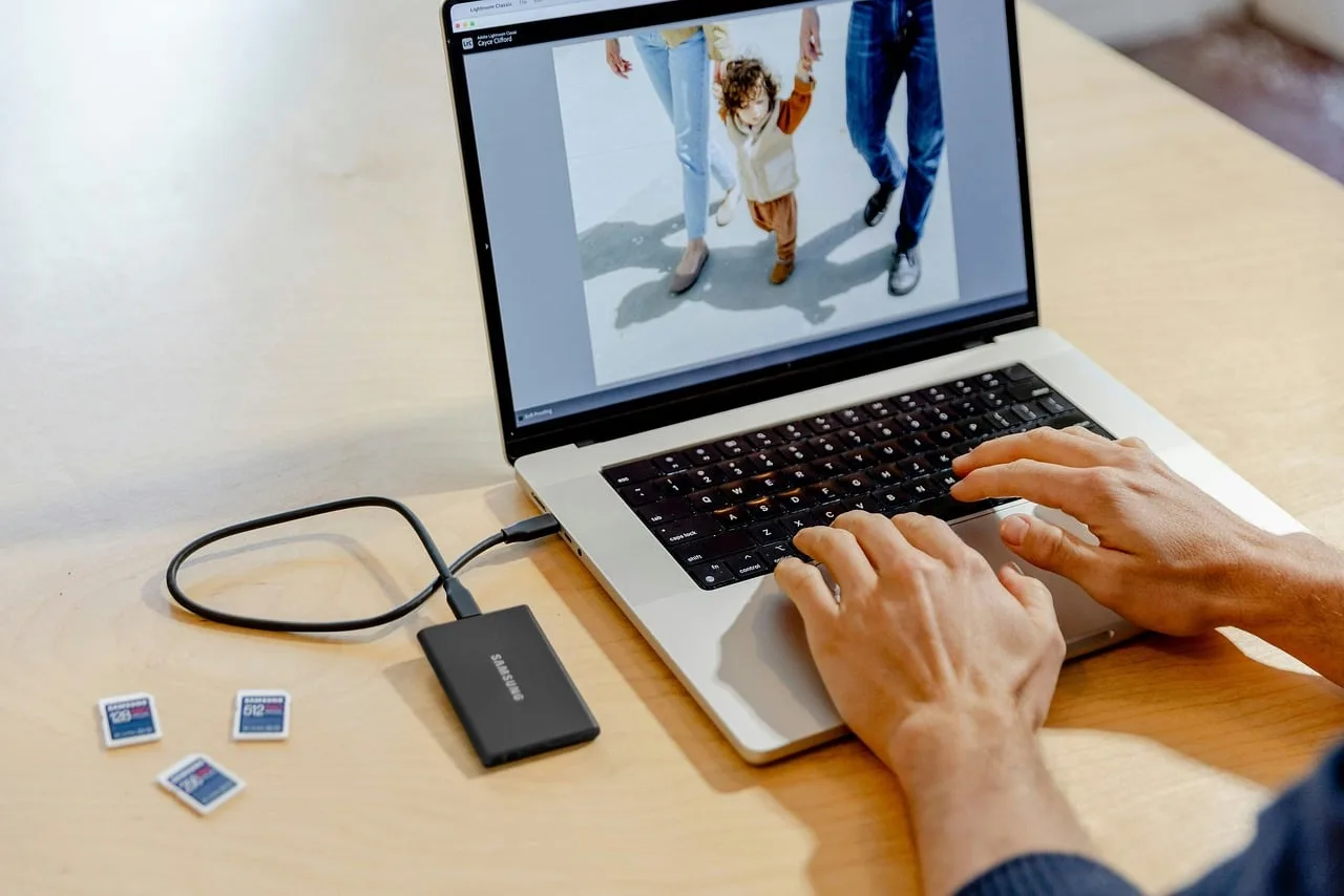 laptop, work, photo editing, image, digital, editing, software, screen, creative, processing, technology, device, workspace, photography, professional, modern, design, retouch, display, portable, productivity, color correction, graphic, media. Switching videography software: a pilot-first method