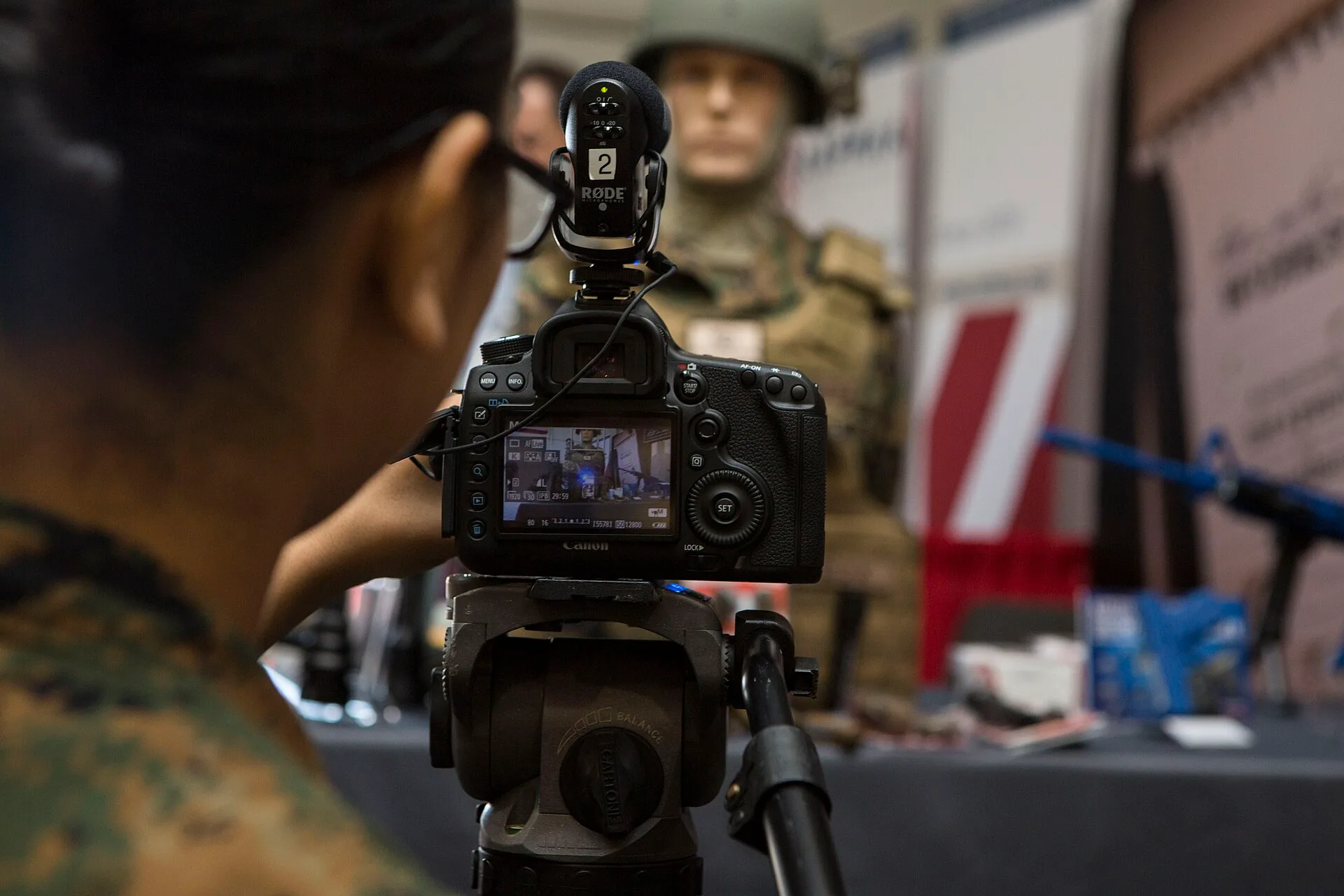 U.S. Marine Corps Lance Cpl. Daphne Rodriguez, combat videographer with Marine Corps Installations East, Camp Lejeune, films a video sequence during the Marine South Military Exposition at the Goettege Field House, Camp Lejeune, N.C., April 7, 2016. The Marine South Exposition is sponsored by the Ma. US-Canada Shoots: Videography Company Operations