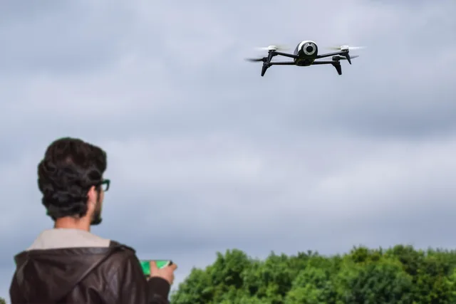 remote, photography, controlled, hobby, filming, rotor, fpv, drone, coaxial, technology, controller, playing, people, sky, fly, beautiful, men, uav, professional, activities, camera, aviation, multicopter, toy, male, multirotor, outdoor, photographer, copter, pilot, control, helicopter, robot, spy, operator, wireless, sunrise, piloting, videography, delivery, high, security, screen, person, adult, park, green, field, mobile, glasses, nature, blue camera, blue mobile, blue robot, blue security, blue film, blue photography. How FAA Part 107 drone rules shape US videography shoots