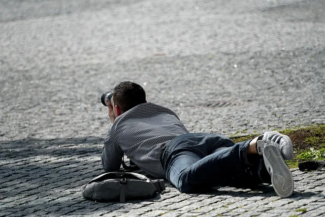 photographer, in action, action, outdoors, human, camera, lying, on the ground, taking photos, watch, lurk, digital camera, recording. How to price videography services: a measurement method