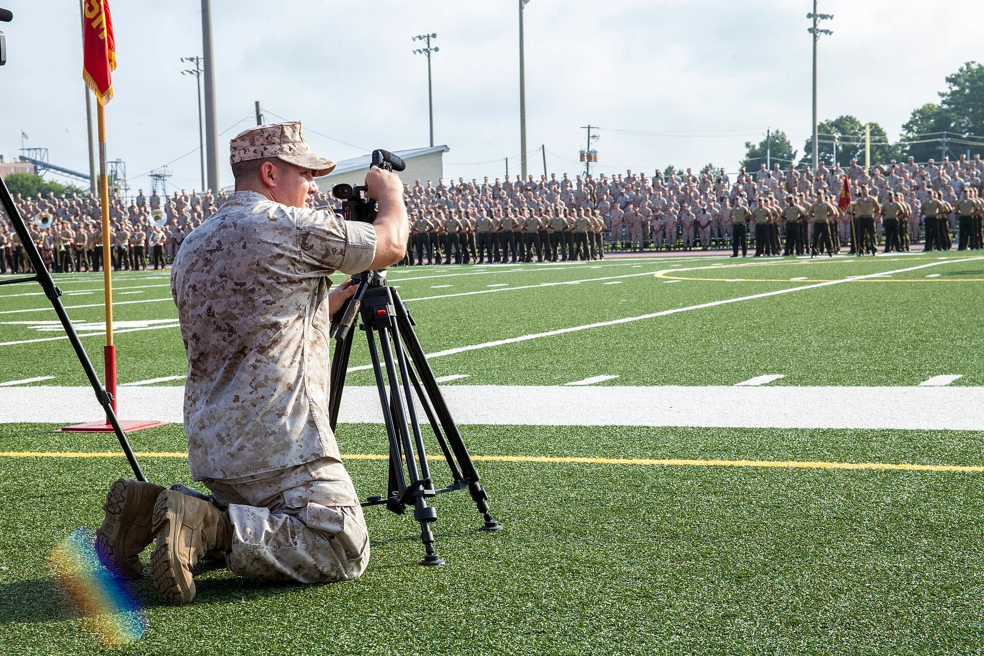 U.S. Marine Corps Staff Sgt. Albert Carls, a combat videographer with Marine Corps Installations East, Marine Corps Base Camp Lejeune Combat Camera, records the 4th Marine Division (4th MARDIV) Association deactivation ceremony at Liversedge Field, Camp Lejeune, N.C., Aug. 6, 2015. Veterans of 4th M. Videography training: what to cover and when