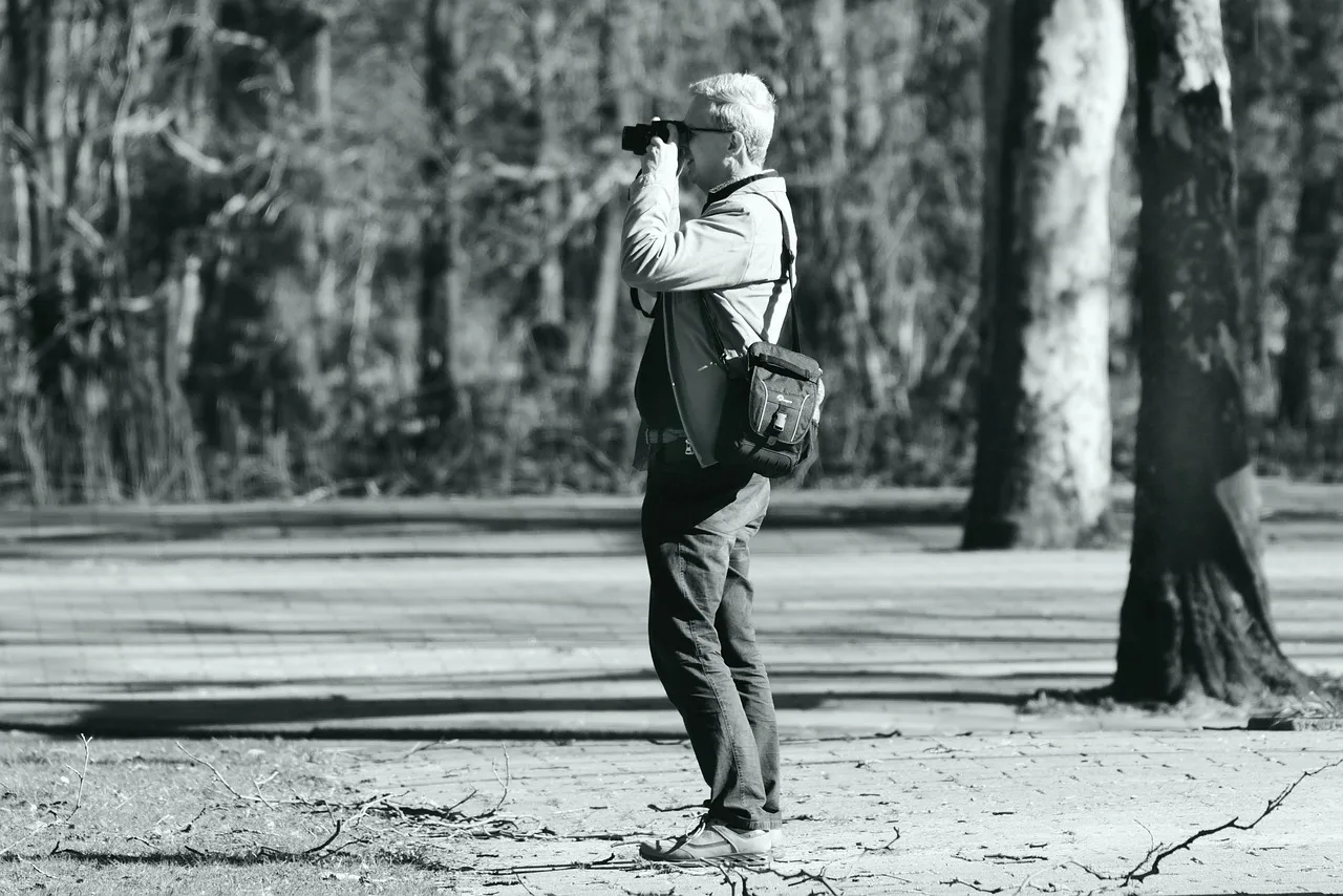photographer, photography, man, camera, gear, standing, shooting, focus, shot, shutter, digital, people, person, gray camera, gray digital, gray photography, gray focus. The real cost of insuring a videography business, explained